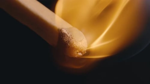 Close up of a match burning in super slow motion, 4k 800fps fire flame match disintegrating