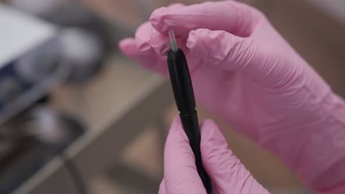Trichologist Preparing Scalp Mesotherapy Dermapen for Treatment