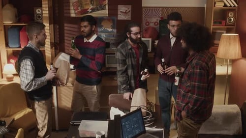 Friends Chatting Casually with Beers in Shared Space