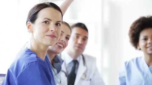 Happy multiethnic doctors meeting at a medical seminar in a hospital