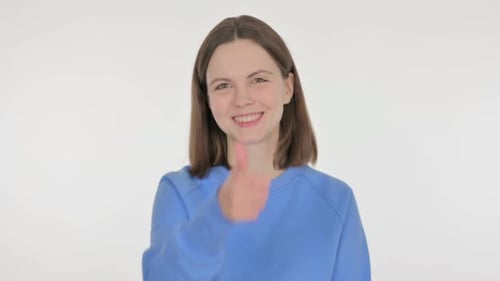 Smiling Woman Gives Thumbs Up on White Background