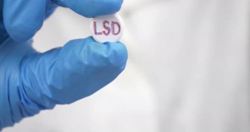 LSD Pill in Doctor Hands Psychedelic Drug for the Treatment of Severe Stages of Depression