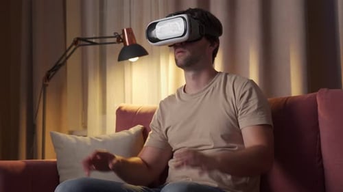 Man Wearing VR Headset Experiencing Virtual Reality