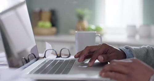 Entrepreneur hands typing on a laptop, as a black professional corporate business man is working