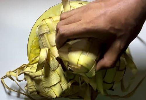 Ketupat Rice Dumplings on Yellow Plate, Close Up