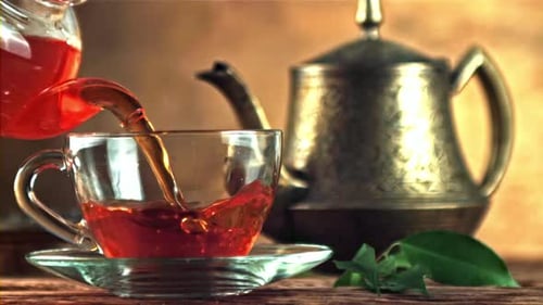 A Super Slow Motion Tea Pours of Air Bubbles
