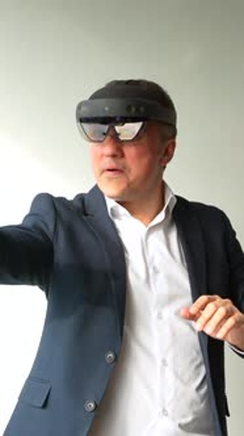 Man Using Mixed Reality Goggles in the Office