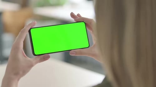 Close Up of Woman Watching Smartphone with Green Screen