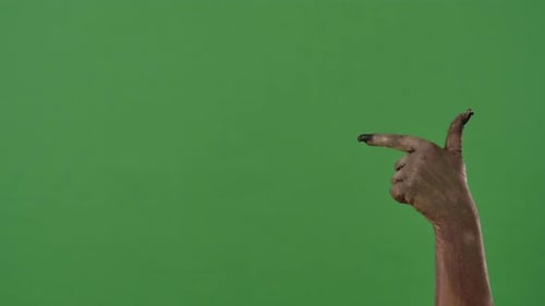A Creepy Zombie Hand Points to the Side