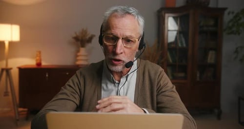 Senior Man Using Laptop for Video Conference