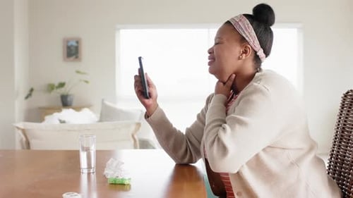 Woman on Video Call with Doctor at Home