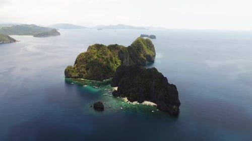 Cloudy weather shades an island in the Philippine Archipelago