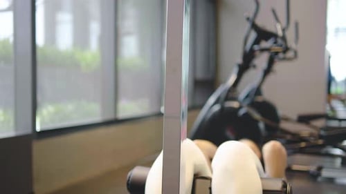 Woman Working Out on Abdominal Crunch Machine