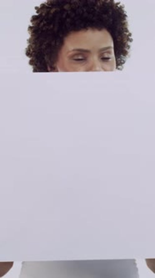 Woman, poster and thinking in studio with promotion, mock up space and afro on white background