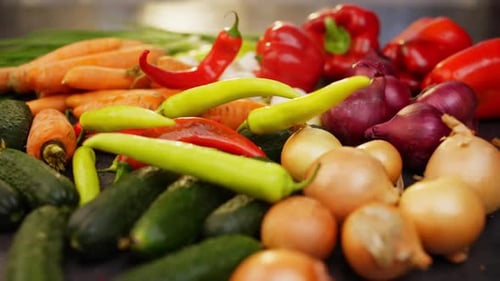 Fresh Vegetables with Colorful Peppers Being Added