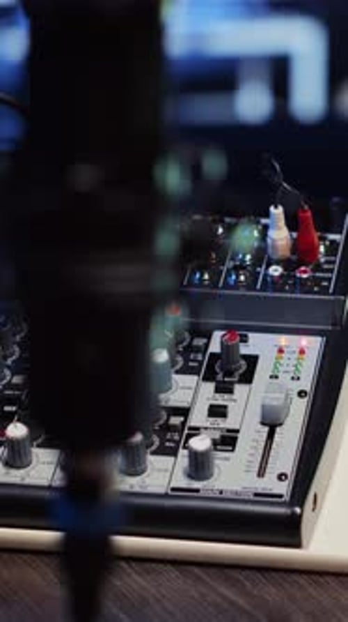 Vertical Video Professional Analog Mixer and Microphone Used to Produce High Fidelity Audio
