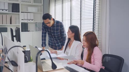 Group of Asian businessman and businesswoman working in the office.