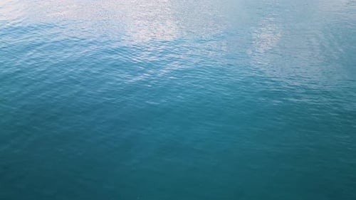 Calm Blue Ocean Waves Ripple in Sunlight