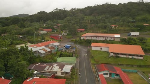 Aerial Slide and Pan Footage of Crossroad and Surrounding Buildings in Small Town or Village