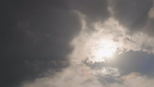 Moody Sky with Sun Shining Through the Clouds