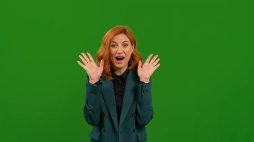 Very surprised female with shocked wow face expression on green screen background.