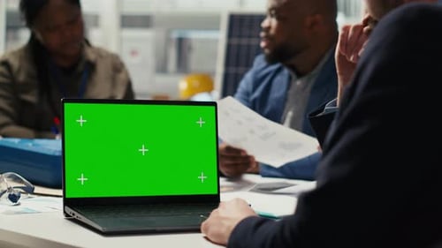 Shareholders Use Mockup Laptop to Assess Deal Feasibility
