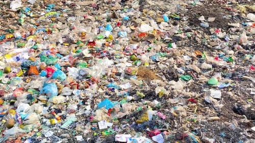 Garbage Dump Site. Pollution Waste Concept. Panning Shot