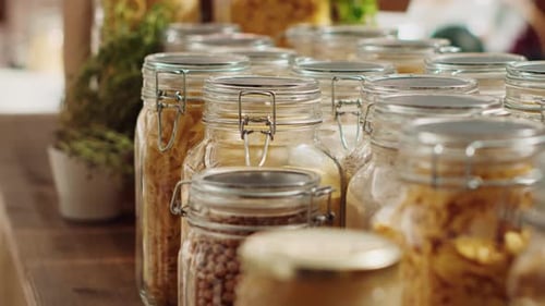 Rows of Glass Jars Containing Dry Goods