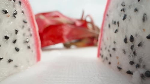 Pitahaya or dragon fruit with white flesh cut in half. Dolly slider extreme close-up. Laowa Probe
