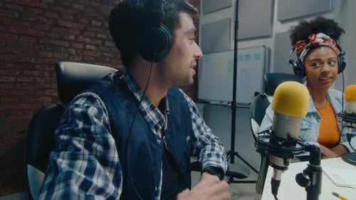 Co-Hosts Having Fun and Recording Podcast at Studio