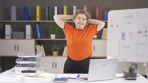 Businesswoman exercising in the office.