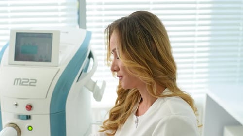 Woman in Hospital Working with Modern Medical Equipment