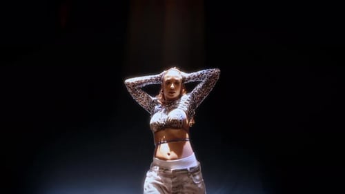 Expressive Hip Hop Dance Solo By Woman In Studio With Beam Lights