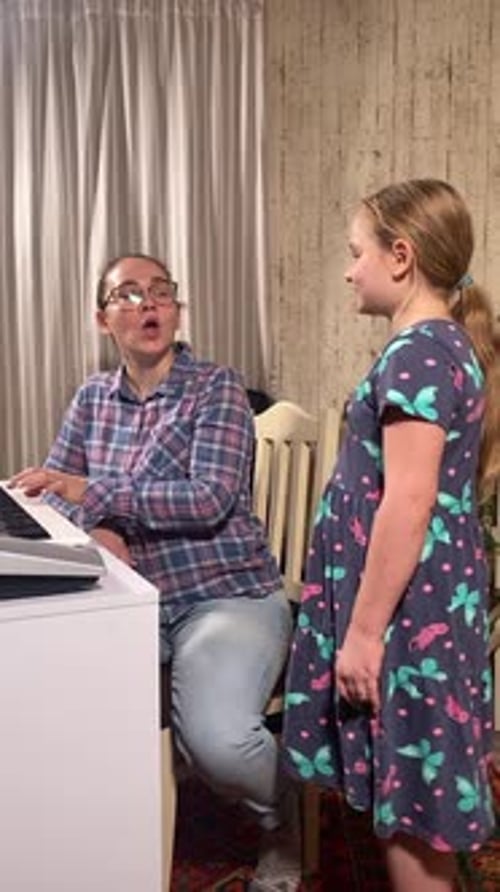 Child Sings With Piano Accompaniment