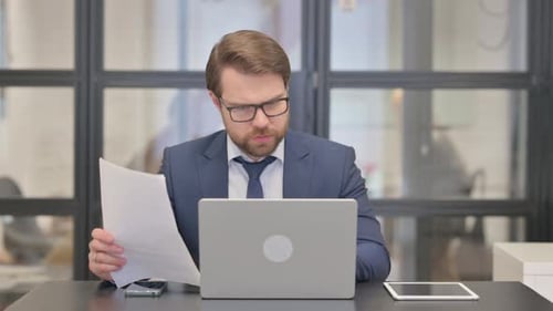 Businessman Working, Then Celebrating Success in Office