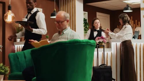 Attentive Staff Serving a Guest in a Hotel Lobby