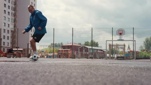 Urban Basketball and Football Area Showcases Intense Sports Practice Session Lone Player Drills with