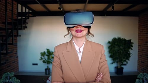Woman using a Virtual Reality headset in an office