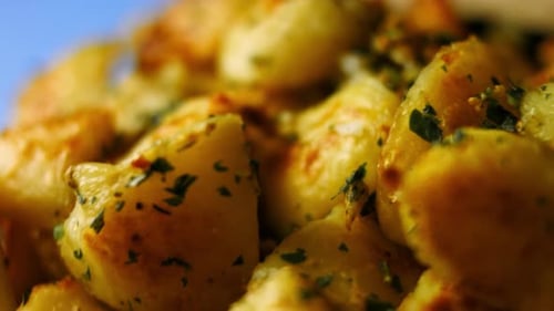 Roasted Potatoes Sprinkled with Herbs Close Up