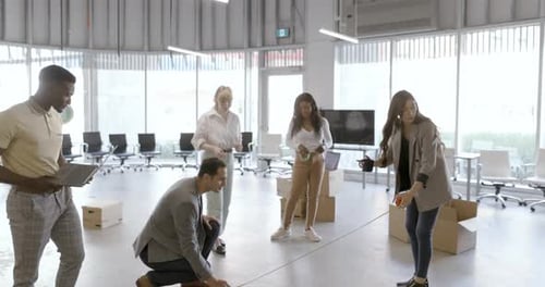 Entrepreneurs Measuring Floor In New Office Slow Motion