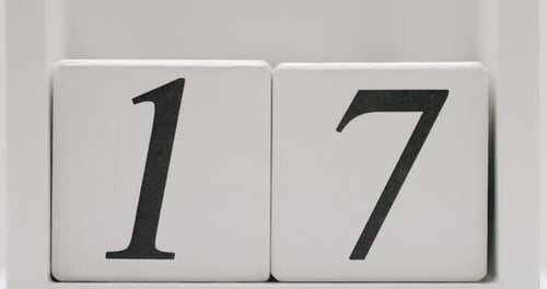 CloseUp of Calendar Date Showing Number Seventeen on Wooden Blocks