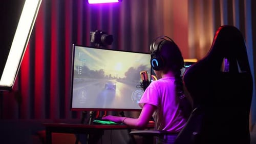 Asian Girl Streamer Celebrating Winning Game On Computer. Live Stream Video Game