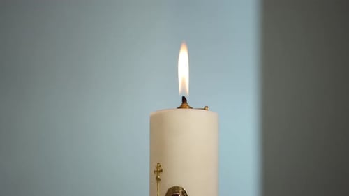 Close up of religious candle burning in a place of worship, church in Slovakia