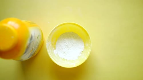 Top View of Baby Powder on White Background