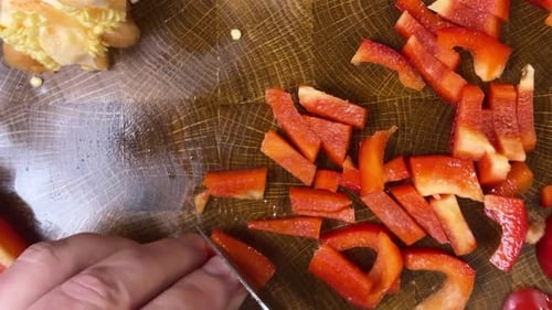 Red Bell Pepper Diced on Wooden Cutting Board