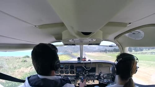 Cockpit view of pilots landing a small plane (slow motion)