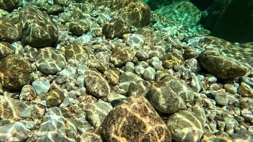 Clear river, underwater photography, light and shadow flowing with the waves, very beautiful