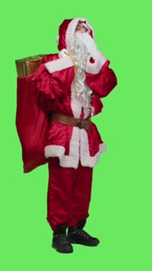 Vertical Video Side View of Sleepy Person in Santa Suit Yawning