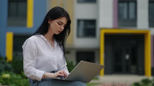 Young Woman Student Working With Laptop In Park In Summer Day Portrait Of Brunette Lady