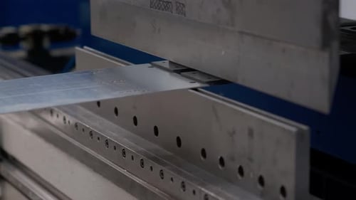 Metal Sheet Bending in Industrial Setting